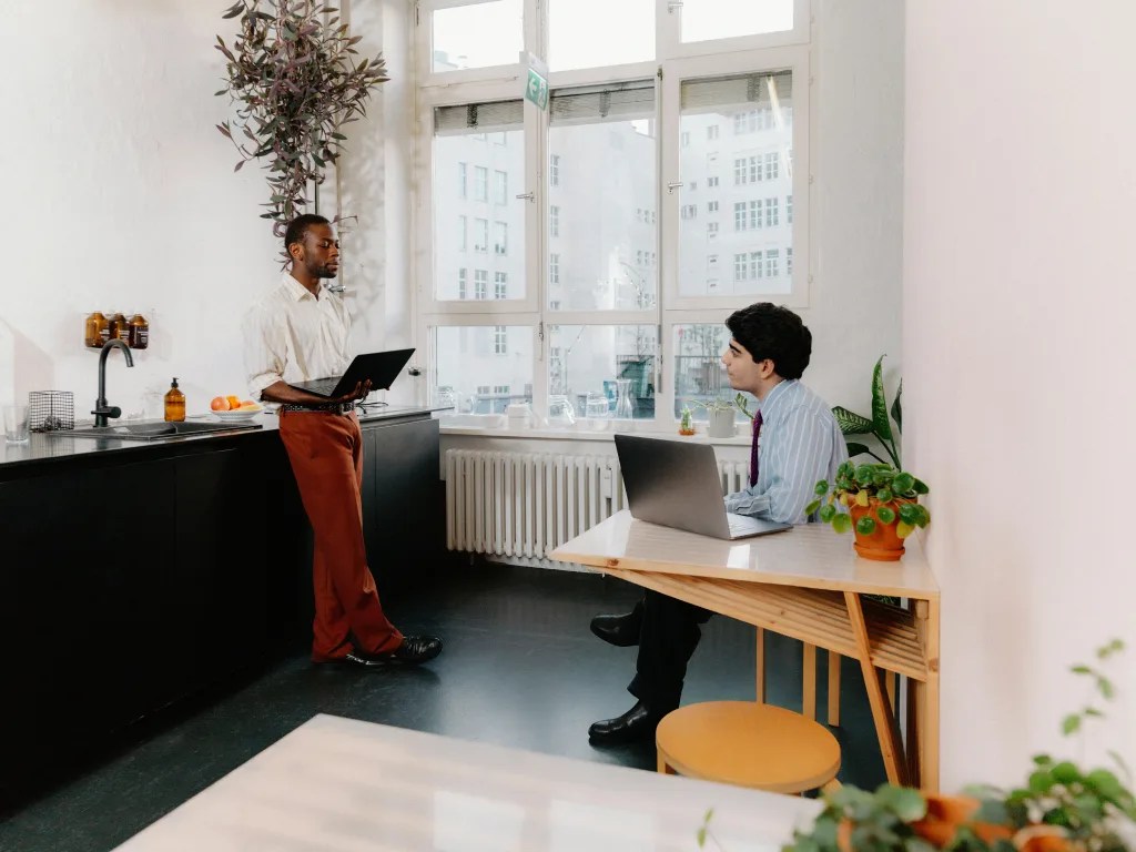 Two men in a conversation at the office.
